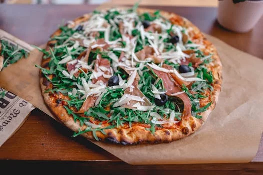 prosciutto pizza with arugula